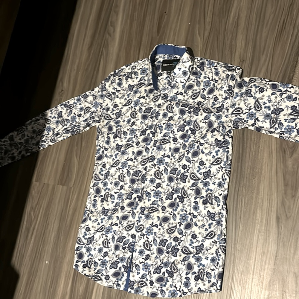 It’s a paparazzi shirt white, and blue.